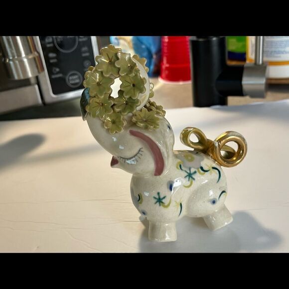 A decorated Elephant? Ceramic. Pink ears. Nose in air. Flowers on trunk. Eyelash - Picture 5 of 14